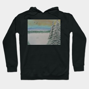 A winter landscape scene with pines Hoodie